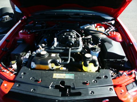 2001 Mercury Grand Marquis - Close-up view of a car's engine bay, showing various components and fluid reservoirs.