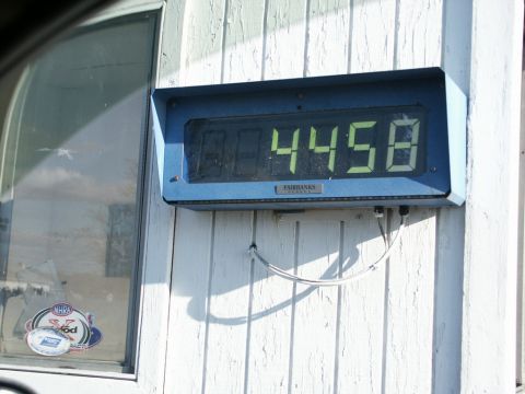2001 Mercury Grand Marquis - A digital scale display shows a weight of 4458, mounted on a building's exterior wall.