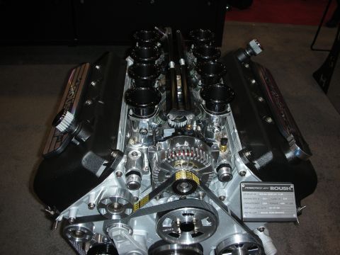 1998 Ford Crown Victoria - Overhead view of a Roush V8 crate engine fitted with eight black individual-throttle velocity stacks.