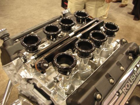 1998 Ford Crown Victoria - Close view of a Roush V8 engine's eight black trumpet-shaped individual throttle-body velocity stacks.