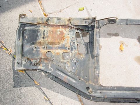 1979 Ford Bronco - This is a rusted section of a vehicle's frame, likely a radiator support or similar component.