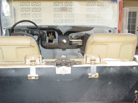 1979 Ford Bronco - Interior of a vehicle, possibly a Ford Bronco, during restoration. Seats and dashboard are visible.