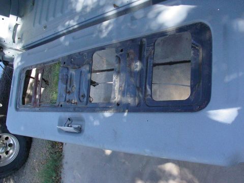 1979 Ford Bronco - The interior of a 1978 Ford Bronco's tailgate shows its internal structure and latch.