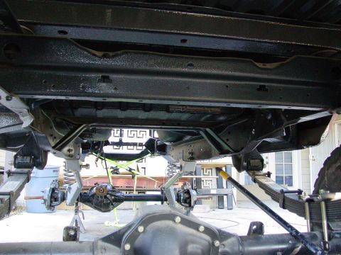1979 Ford Bronco - The underside of a 1979 Ford Bronco reveals its robust frame and suspension system.