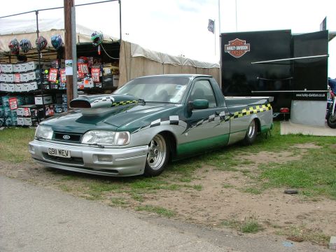 2001 Ford Fiesta - Customized Ford pickup truck with drag racing modifications and checkerboard graphics.