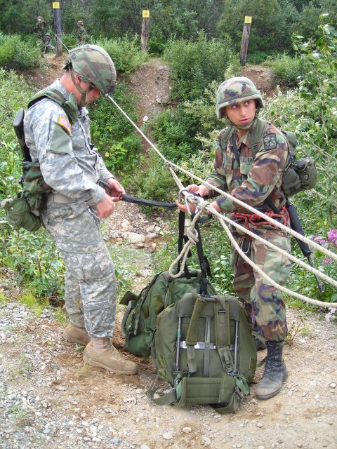 2003 Jeep TJ - Soldiers prepare equipment for an outdoor training exercise involving ropes and rappelling.