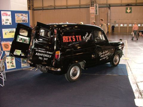 2001 Ford Fiesta - A vintage black van, possibly a Ford Thames, is displayed indoors with its rear doors open.