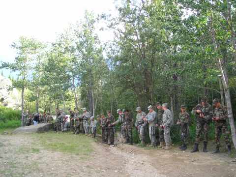 2003 Jeep TJ - Soldiers are gathered in a wooded area, preparing for a rappelling exercise.
