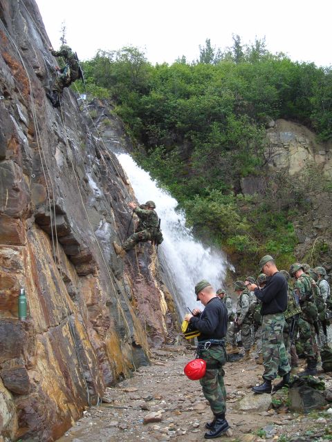 2003 Jeep TJ - Military training exercise involving rappelling down a cliff face with a waterfall.