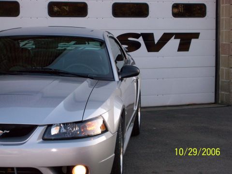 1998 Ford Taurus - Silver Ford Mustang in front of SVT garage door. Photo dated October 29, 2006.