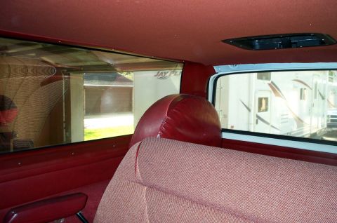 1996 Ford Bronco - Interior view of a vehicle, showing seats and a spare tire cover. 'SUPERMOTORS' logo is visible.