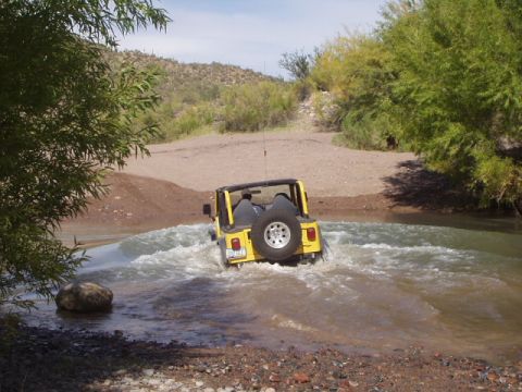 1993 Ford Bronco - we found a nice water crossing out there, here is eric crossing it. lets just say he got a little wet with no doors