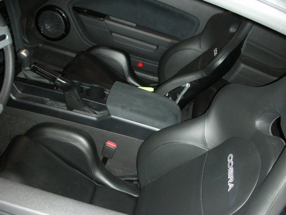 Black leather Cobra sport seats and center console interior of a coupe