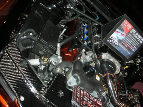 1998 Ford Crown Victoria - engine bay fitted with a Hellion turbo system and a printed info placard sits over a carbon-fiber-lined bay.