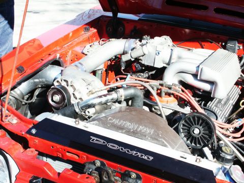 2001 Mercury Grand Marquis - Close-up view of a modified engine bay a supercharger and custom fan shroud.