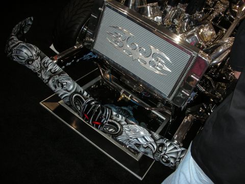 1998 Ford Crown Victoria - custom engine bay shows a finned intercooler and chromed components alongside an airbrushed biomechanical-skull panel.