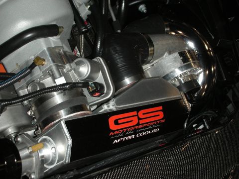 1998 Ford Crown Victoria - polished supercharger feeds a GS Motorsports after-cooled intercooler unit mounted over carbon fiber in a custom engine bay.