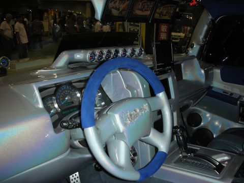 1998 Ford Crown Victoria - Custom vehicle interior featuring a silver dash, blue-and-silver wrapped steering wheel, row of auxiliary gauges and chrome shifter.