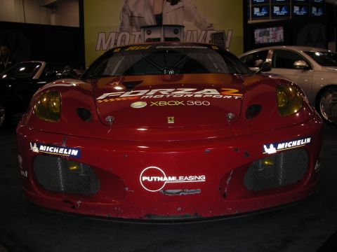1998 Ford Crown Victoria - front fascia of a red Ferrari race car showing Forza 2, Xbox 360 and Putnam Leasing decals and large mesh brake ducts.