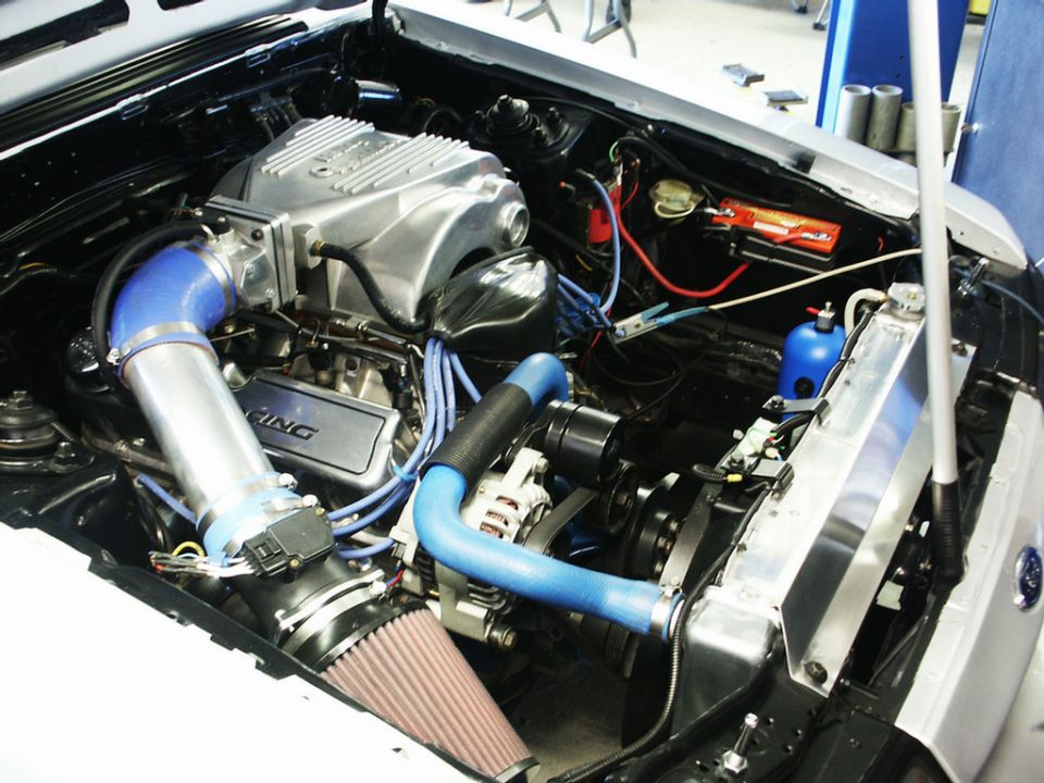 Engine bay with custom intake, aluminum intake manifold, and aftermarket radiator