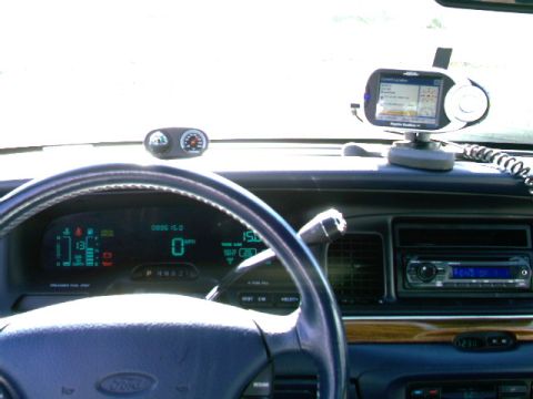 1996 Ford Crown Victoria - Interior view of a 1996 Ford Crown Victoria, a GPS unit and digital dashboard displays.