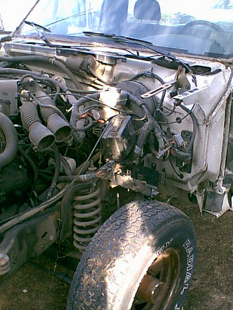1983 Ford Bronco - here is the last shot of the drivers side harness mess. now it is time to start to remove stuff.