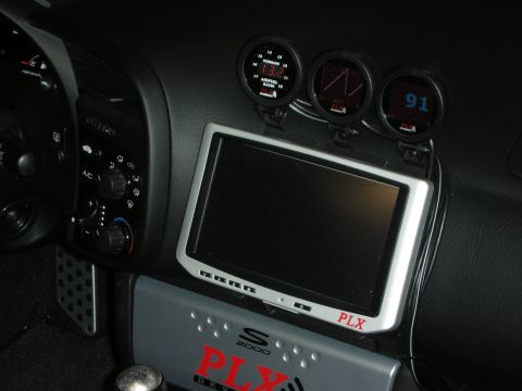 1998 Ford Crown Victoria - car interior shows a PLX touchscreen on the center console flanked by three round gauges reading 13.6, AFR and 91.