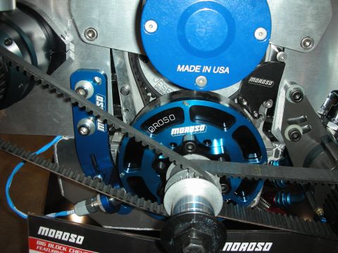 1998 Ford Crown Victoria - close-up of a blue Moroso drive pulley and toothed belts on a display engine, with Made in USA text visible.