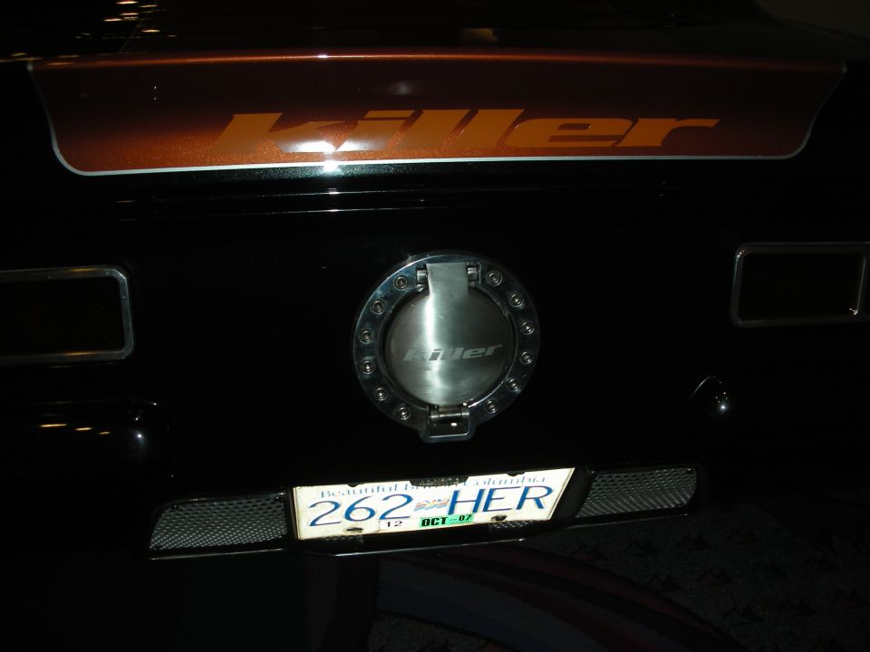 Vehicle rear with Killer logo, billet fuel door and 262 HER license plate