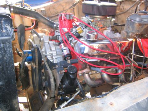 1979 Ford Bronco - Close-up view of a modified V8 engine, showing the distributor, carburetor, and exhaust manifolds.