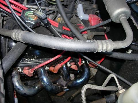1993 Ford Bronco - Close-up view of an engine bay, showing various components and wiring.
