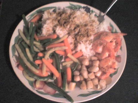 1984 Ford Bronco - A close-up view of a meal served on a plate, rice, shrimp, and mixed vegetables.