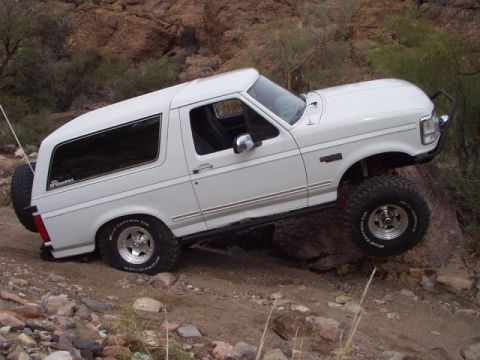 1993 Ford Bronco - This 1993 Ford Bronco navigates a challenging rocky trail, its off-road capabilities.