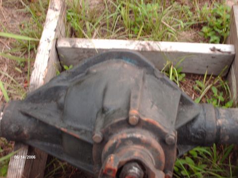 1982 Ford F-100 - A rear axle differential assembly is shown, likely for a truck or heavy-duty vehicle, with visible bolts on the housing.