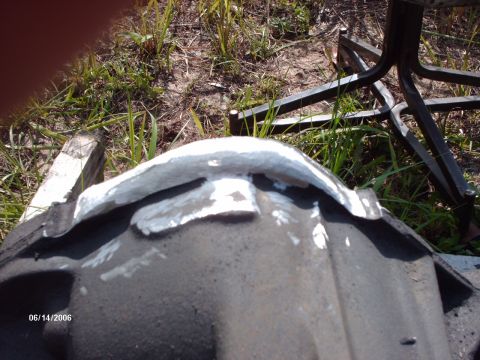 1982 Ford F-100 - A differential housing is shown with white putty applied to its surface, outdoors.