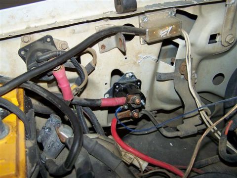 1995 Ford Bronco - The starter solenoid and associated wiring are visible in this engine bay close-up.