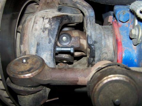 1995 Ford Bronco - Front suspension steering linkage components, including tie rod end and drag link.