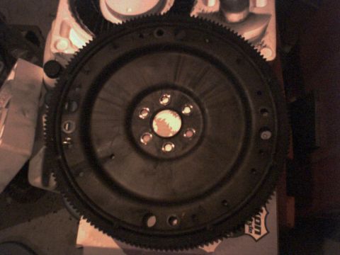 1983 Ford Bronco - A close-up view of a vehicle flywheel, a critical engine component.