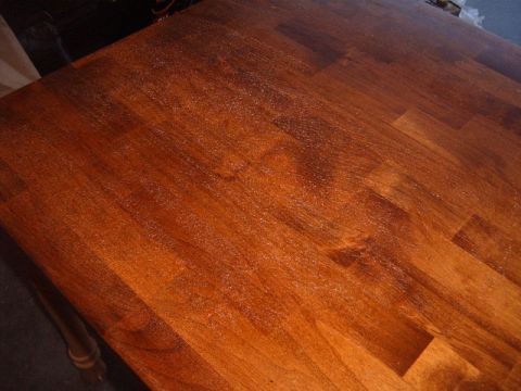 1988 Ford Bronco - Wooden tabletop recently refinished, showing wood grain and a glossy finish.