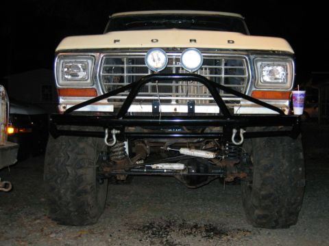 1992 Ford Mustang - Front view of a modified Ford truck with a custom bumper and off-road tires.