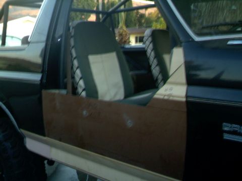 1989 Ford Bronco - Custom door panels and roll cage are visible inside this vehicle's interior.