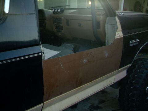 1989 Ford Bronco - Interior view of a 1989 Ford Bronco with the driver's door panel removed.