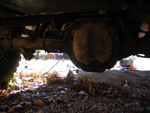 1984 Ford Bronco - Underside view of a vehicle's rear axle differential and drive shaft.