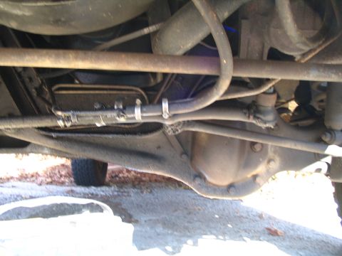 1984 Ford Bronco - Close-up of the undercarriage, showing the differential and steering components of an unidentified vehicle.