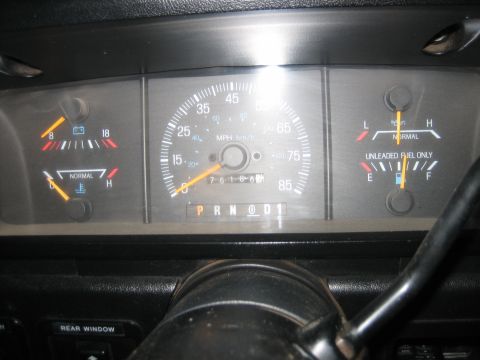 1990 Ford Bronco - The dashboard gauges of a 1990 Ford Bronco, including the speedometer, fuel level, and temperature indicators.