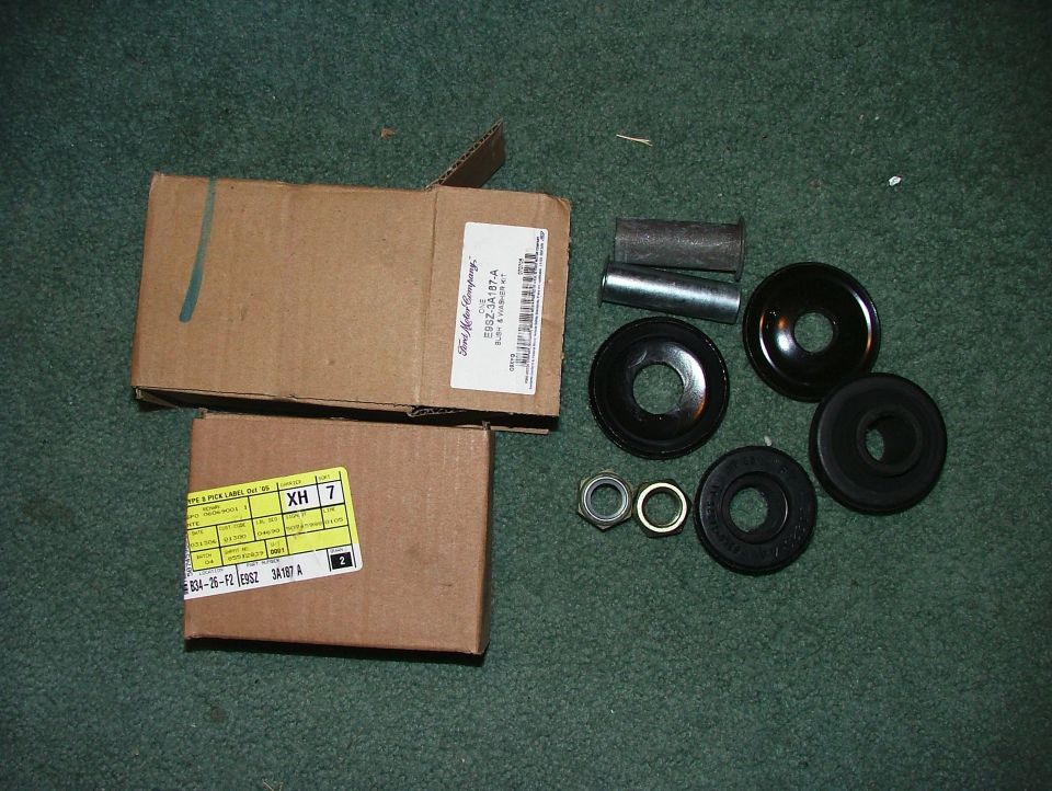 Ford bush & washer kit E9SZ-3A187-A parts and labeled boxes laid out on green carpet