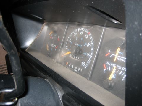 1990 Ford Bronco - Dashboard gauges for a 1990 Ford Bronco, including speedometer, fuel level, and temperature indicators.