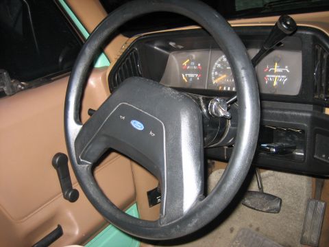 1990 Ford Bronco - Interior view of a 1990 Ford Bronco, the steering wheel and dashboard.