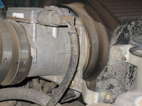 1995 Ford Bronco - Mass air flow sensor and intake tube assembly, likely from an engine bay.