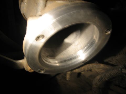1995 Ford Bronco - A metal pipe fitting is shown in detail, with threads and bolt holes clearly visible.